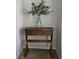 Entryway table with eucalyptus arrangement and rustic charm at 1507 Wynnes Ridge Se Cir, Marietta, GA 30067