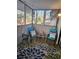 Screened porch with seating, a patterned rug, and views of the surrounding trees at 1507 Wynnes Ridge Se Cir, Marietta, GA 30067