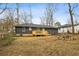Spacious backyard with a newly built deck and mature trees at 1682 Valencia Rd, Decatur, GA 30032