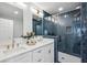 Modern bathroom with white vanity, dual sinks, and a large walk-in shower at 1682 Valencia Rd, Decatur, GA 30032