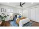 Spacious bedroom with hardwood floors, ceiling fan, and ample closet space at 1682 Valencia Rd, Decatur, GA 30032