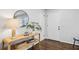 Bright and airy entryway with console table, mirror, and hardwood floors at 1682 Valencia Rd, Decatur, GA 30032