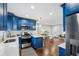 Bright kitchen boasts blue cabinets, an island, and stainless steel appliances at 1682 Valencia Rd, Decatur, GA 30032