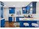 Modern kitchen with blue cabinets, white countertops, and stainless steel appliances at 1682 Valencia Rd, Decatur, GA 30032