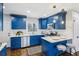 Modern kitchen with blue cabinets, white countertops, and stainless steel appliances at 1682 Valencia Rd, Decatur, GA 30032