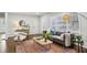 Living room boasts hardwood floors, comfy seating, and a large window at 1682 Valencia Rd, Decatur, GA 30032