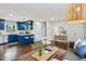 Open concept living and kitchen area with hardwood floors and stylish decor at 1682 Valencia Rd, Decatur, GA 30032
