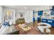 Open living area with hardwood floors, stylish furniture, and a view of the kitchen at 1682 Valencia Rd, Decatur, GA 30032