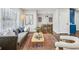 Open living space features a gray sofa, wood coffee table, and area rug at 1682 Valencia Rd, Decatur, GA 30032