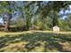 Large backyard with storage shed and mature trees at 1709 Valencia Rd, Decatur, GA 30032