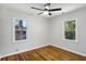 Hardwood floor bedroom with two windows at 1709 Valencia Rd, Decatur, GA 30032