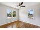 Bedroom with hardwood floors and large window at 1709 Valencia Rd, Decatur, GA 30032