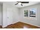 Hardwood floor bedroom with two windows and closet at 1709 Valencia Rd, Decatur, GA 30032