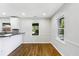 Bright dining area with hardwood floors and wainscoting at 1709 Valencia Rd, Decatur, GA 30032