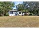 Newly renovated ranch home with light blue front door and landscaped yard at 1709 Valencia Rd, Decatur, GA 30032