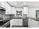 Modern kitchen with granite countertops and stainless steel appliances at 1709 Valencia Rd, Decatur, GA 30032