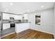 Modern kitchen with white cabinets, granite counters, and stainless steel appliances at 1709 Valencia Rd, Decatur, GA 30032