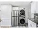 Laundry room with stainless steel washer and dryer at 1709 Valencia Rd, Decatur, GA 30032