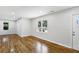 Hardwood floors and neutral walls in this spacious living room at 1709 Valencia Rd, Decatur, GA 30032