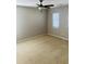 Neutral bedroom with beige carpet, window with blinds and ceiling fan at 1963 White Top Rd. Se, Lawrenceville, GA 30045