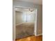 Carpeted bedroom with a ceiling fan and a large window offering plenty of natural light at 1963 White Top Rd., Lawrenceville, GA 30045