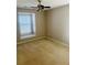 Bedroom with neutral walls, window with blinds, and ceiling fan at 1963 White Top Rd., Lawrenceville, GA 30045