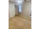 Neutral bedroom with beige carpet, window with blinds and ceiling fan and closet at 1963 White Top Rd. Se, Lawrenceville, GA 30045