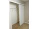 Open closet with white wire shelving and sliding door at 1963 White Top Rd., Lawrenceville, GA 30045