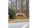 Brick entrance sign to Chandler Woods community, surrounded by trees at 1963 White Top Rd., Lawrenceville, GA 30045