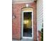 Arched brick entrance frame with view into house at 1963 White Top Rd., Lawrenceville, GA 30045