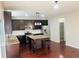 Modern kitchen featuring stainless appliances, granite countertops, an island and dark cabinets at 1963 White Top Rd., Lawrenceville, GA 30045