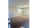 Inviting living room with plush neutral carpet, light walls, and natural light at 1963 White Top Rd. Se, Lawrenceville, GA 30045