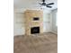 Bright living room featuring stone fireplace and built-in shelving at 1963 White Top Rd., Lawrenceville, GA 30045