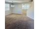 Cozy living area featuring neutral walls, plush carpet and natural light at 1963 White Top Rd. Se, Lawrenceville, GA 30045