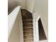 Carpeted staircase with white railing leading to the lower level of the home at 1963 White Top Rd. Se, Lawrenceville, GA 30045