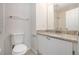 Updated bathroom with granite countertop and white cabinets at 277 Ralph David Abernathy Sw Blvd, Atlanta, GA 30312