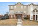 Tan two-story townhome with double front doors and small front yard at 277 Ralph David Abernathy Sw Blvd, Atlanta, GA 30312