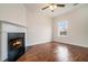 Living room with hardwood floors, fireplace and large window at 277 Ralph David Abernathy Sw Blvd, Atlanta, GA 30312