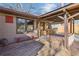 Covered back porch with wooden deck and string lights at 3001 Hilltop Dr, Atlanta, GA 30341