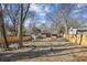 Large backyard with mature trees and wooden fence at 3001 Hilltop Dr, Atlanta, GA 30341