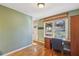 Bright home office with wood desk and backyard view at 3001 Hilltop Dr, Atlanta, GA 30341