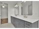 Elegant bathroom featuring double sinks, modern fixtures, and sleek cabinetry at 350 Sugarview Rd, Sugar Hill, GA 30518