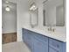 Double vanity bathroom with blue cabinets and white countertops at 350 Sugarview Rd, Sugar Hill, GA 30518