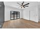 Spacious bedroom with sleek ceiling fan and sliding doors to outdoor living space at 350 Sugarview Rd, Sugar Hill, GA 30518