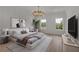 Serene bedroom featuring a neutral palette, stylish lighting, and ample natural light at 350 Sugarview Rd, Sugar Hill, GA 30518