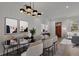 Modern dining room featuring a designer chandelier and elegant decor for stylish entertaining at 350 Sugarview Rd, Sugar Hill, GA 30518