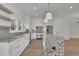 Modern kitchen with white cabinets and granite countertops at 350 Sugarview Rd, Sugar Hill, GA 30518