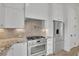 Stainless steel appliances and granite countertops enhance this functional kitchen at 350 Sugarview Rd, Sugar Hill, GA 30518