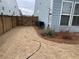 Small backyard with wooden fence and landscaping at 4338 Braden Nw Ln, Kennesaw, GA 30144