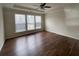 Spacious bedroom with hardwood floors and ceiling fan at 4338 Braden Nw Ln, Kennesaw, GA 30144